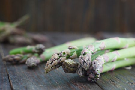 Fresh green asparagus on rustic wooden table. Healthy food.の写真素材