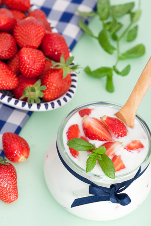 Fresh Organic Greek Yogurt with strawberries and mint leavesの写真素材