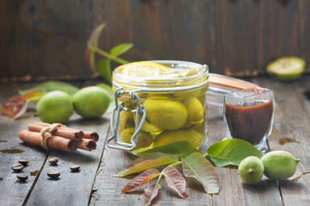 Preparing green walnut liqueur. Homemade healthy walnut liquor.の写真素材