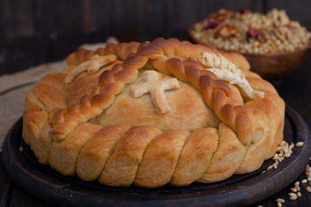 Serbian slava cake with a cross, close up.  Slavski kolaÄ. Decorative bread for traditional...