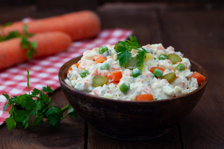 Traditional russian salad "Olivier" from boiled vegetables and meat with mayonnaiseの写真素材