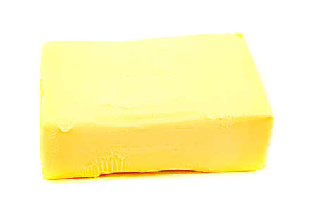 piece of butter on a white background isolatedの写真素材