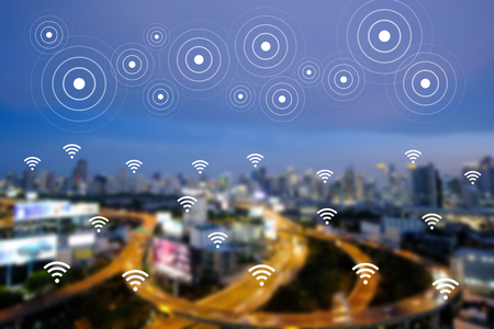 WiFi network on blurred cityscape background. Technology 4.0 concept. The city of connection and big...