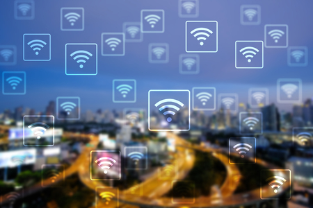 WiFi network on blurred cityscape background. Technology 4.0 concept. The city of connection and big data.の写真素材