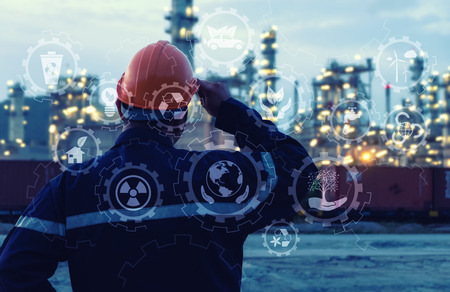 Engineer is standing on large industry background. The construction manager on the industry...