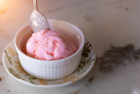 Ice cream strawberry in white cup.の写真素材