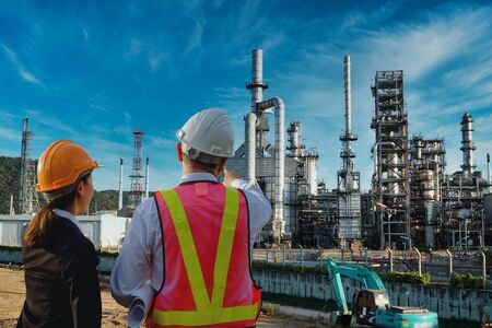 Petrochemical industry on sunset and Twilight sky with engineer or worker, Power plant, Energy power...