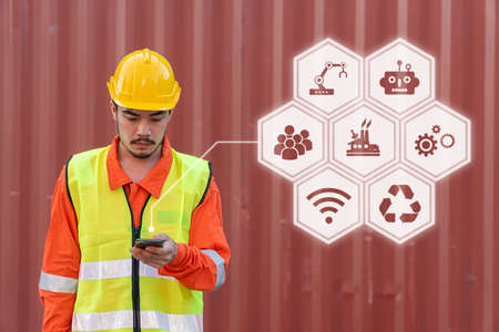 Engineer is working on Smart Phone at container yard. Industrial Container yard for Logistic Import Export business.の写真素材
