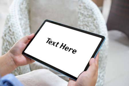 a woman's hand holding a tablet along with white screen template.