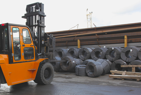 Storage fixtures in the round coils with a forkliftの写真素材