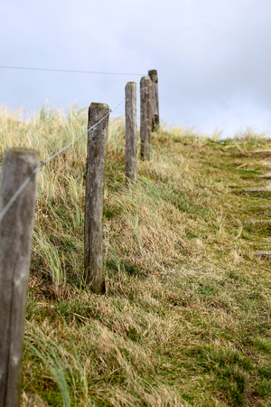 Elements of fence on the beach, North Holland, Europeの写真素材