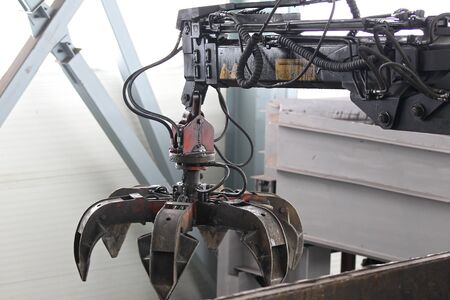 six-petalled industrial crane for loading and unloading of various materialsの写真素材