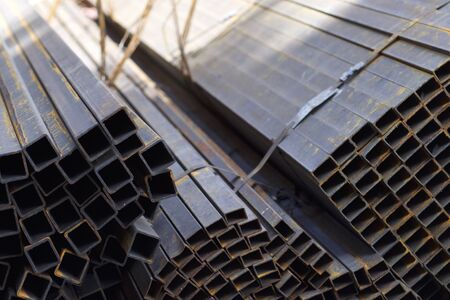 Metal profile pipe of rectangular cross section in packs at the warehouse of metal products, Russiaの写真素材