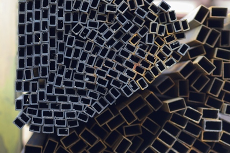 Metal profile pipe of rectangular cross section in packs at the warehouse of metal products, Russiaの写真素材