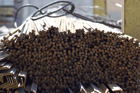 Metal profile of round section in packs at the warehouse of metal products, Russiaの写真素材
