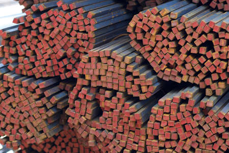 Metal profile square in packs at the warehouse of metal products, Russia
