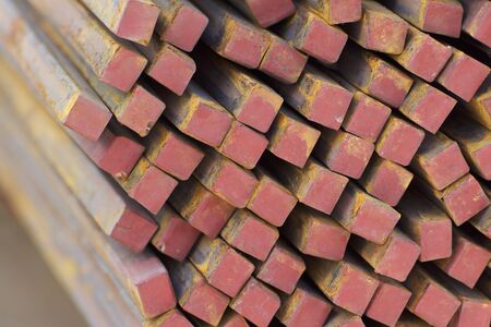 Metal profile square in packs at the warehouse of metal products, Russia