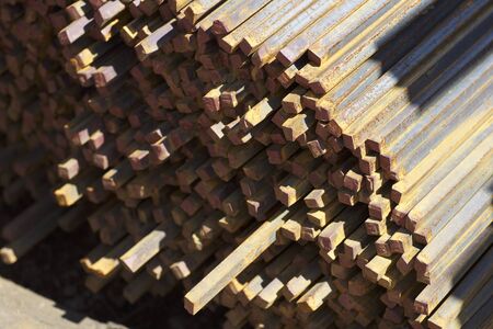 Metal profile square in packs at the warehouse of metal products, Russia