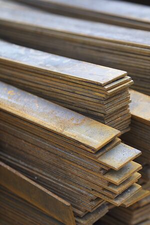 Metal profile strip in packs at the warehouse of metal products, Russia