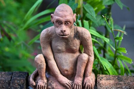 Ancient sculpture of a sitting creature, Thailandの写真素材