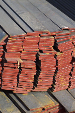 Metal profile strip in packs at the warehouse of metal products, Russia