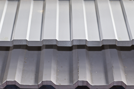 Profiled galvanized sheet with polymer coating in packs in the warehouse of metal products, Russiaの写真素材