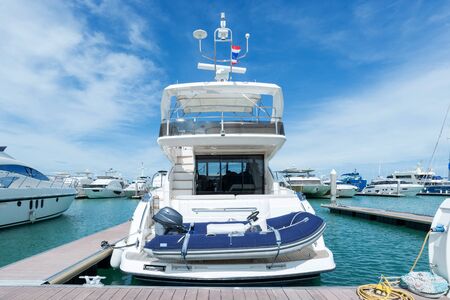 A luxury yacht docked in the parking of boats and yachts in Ocean Marina Thailandの写真素材