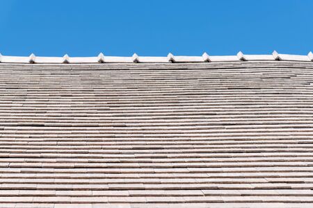 Modern marble tile roof with blue skyの写真素材