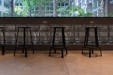 Beautiful modern group set of wooden chairs with countertop for reading and relaxation decoration interior contemporaryの写真素材