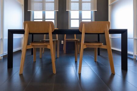 Modern wooden table and chairs in conference room meeting room Interior of modern open space office...