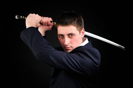 Young man hold swordの写真素材