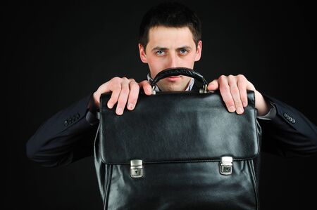 Young man hold suitcaseの写真素材