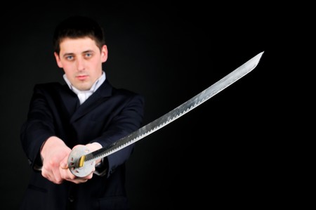 Young man hold swordの写真素材