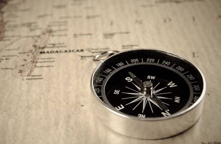 compass on old world map