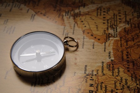 compass on old world map