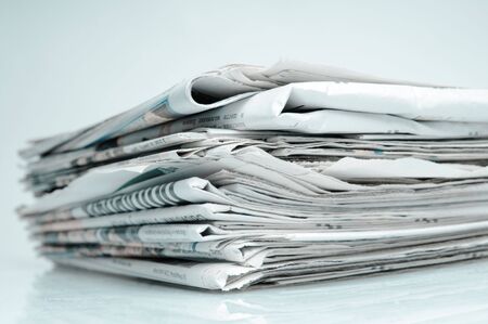 Stack of newspapers. Toned in blue.