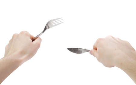 Idolated human hands with dinner equipments