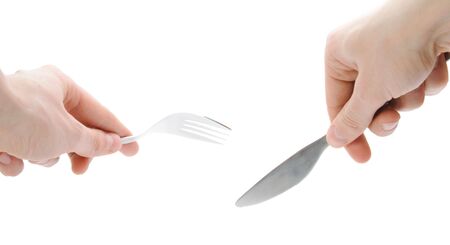 Isolated human hands with dinner equipmentsの写真素材