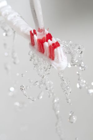 Toothbrush in a water splashの写真素材