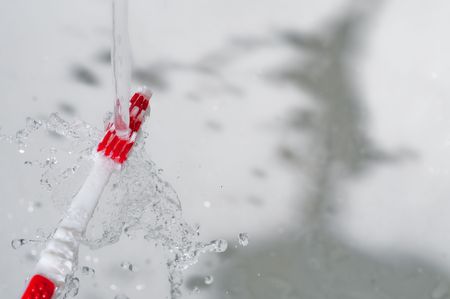 Toothbrush in a water splashの写真素材