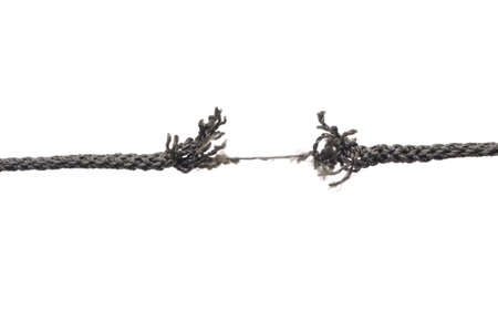 Breaking rope. Isolated over white.の写真素材