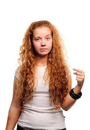 Cute ginger girl pointing at somethingの写真素材