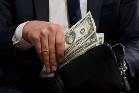 Businessman with money in hands.の写真素材