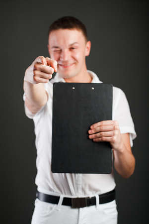 Man pointing at camera. Focused on amの写真素材