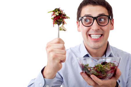 Man and salad. Focused on forkの写真素材