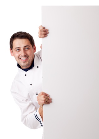 Male chef holding blank board. Isolated over white.の写真素材
