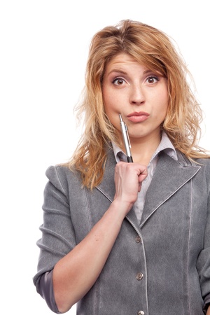 Portrait of thinking woman with penの写真素材