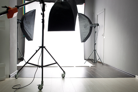 interior of modern photo studio with lighting equipmentの写真素材