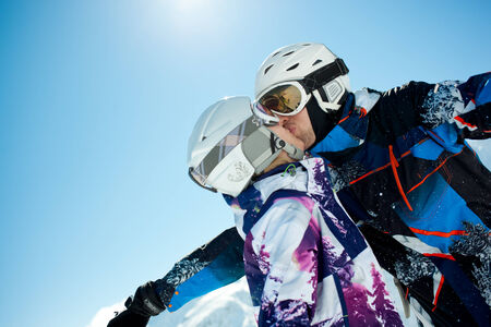 Young couple kissing in winter vacationの写真素材