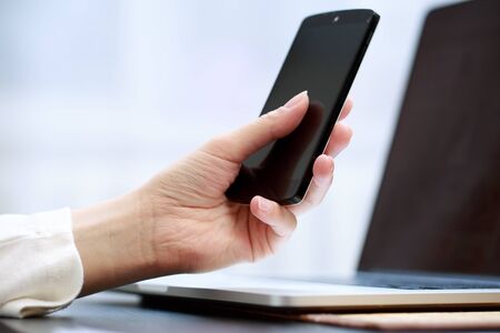 Woman using a mobile phoneの写真素材